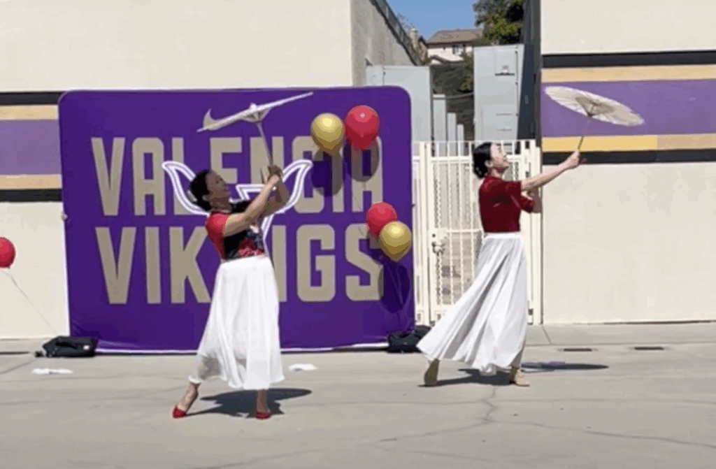 duet dance featuring umbrellas