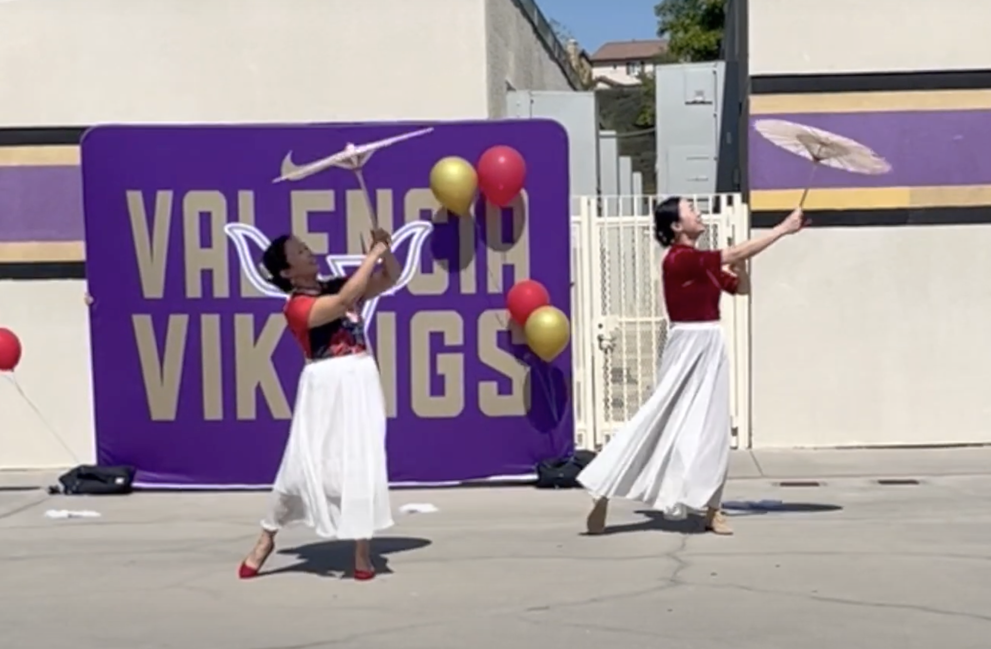 duet dance featuring umbrellas