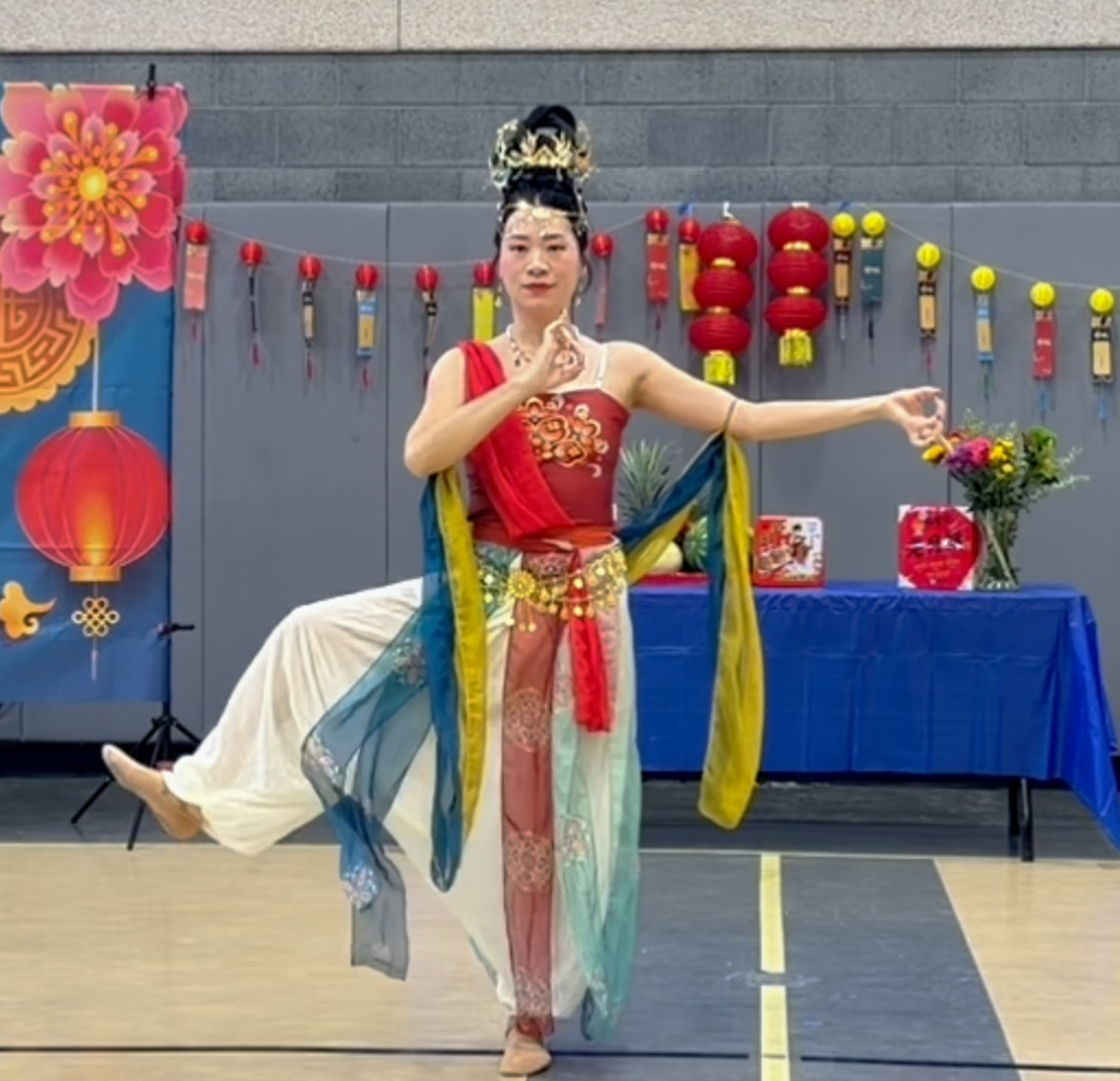 Full-body shot showing the Dunhuang costumes and headdresses