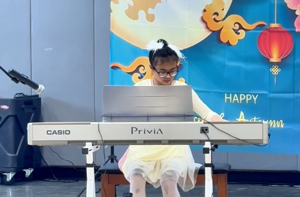 Cora Butterworth performing Clair de Lune on piano