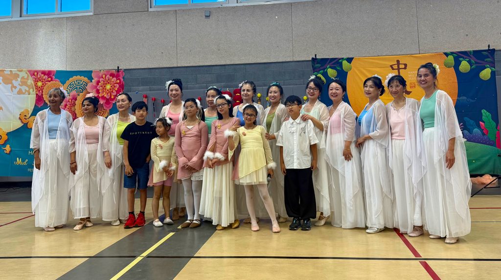 Wide photo of the dancers or full group at the Newhall Community Center